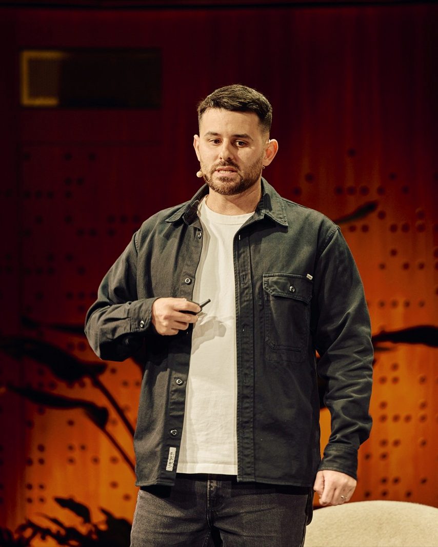 Daniel Brady speaking on stage